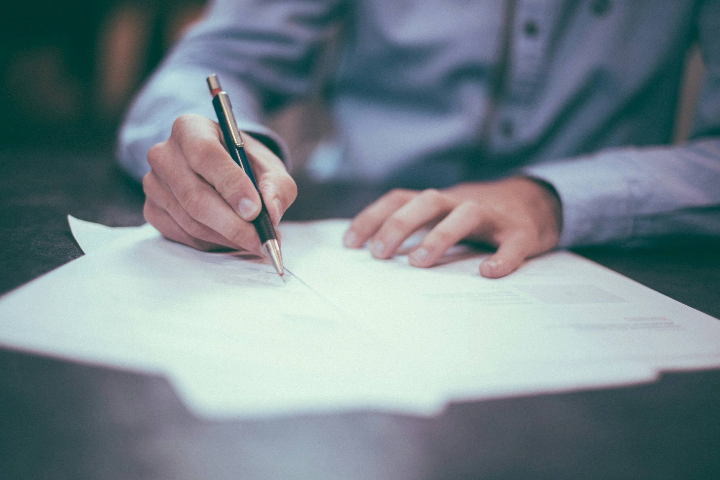 Owner financing paperwork being signed